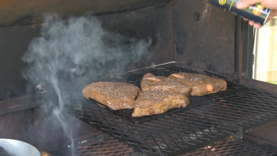 SmokingPit.com - Honey Ginger Flank Steak recipe wood fire cooked on my Scottsdale Santa Maria style cooker. Cold smoing the flank steak. 