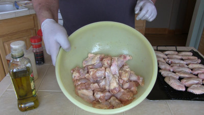 SmokingPit.com - Kentucky Bourbon Glazed Chicken Wings.  Slow cooked on the yoder YS640. Seasoning the wings.