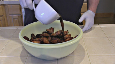 SmokingPit.com - Sesame Soy Chicken Wings.  Slow cooked on the yoder YS640. - Adding the finishing sauce.