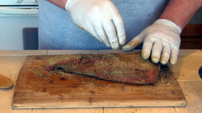 SmokingPit.com - Southwest Tri Tip Roast recipe wood fire cooked on my Scottsdale Santa Maria style cooker. Applying the rub.