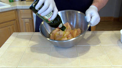 SmokingPit.com - Spicy Parmesan Chicken Tenders slow cooker on a Yoder YS640 Pellet cooker - Applying extra virgin olive oil.