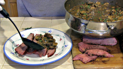 SmokigPit.com - Beef Tri Tip Marsala Recipe - slow cooked on a Yoder YS640 Pellet smoker. - Applying marsala sauce to the Tri Tip roast.